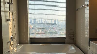 Bathroom with a large window view