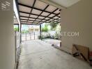 Covered carport with view of the front yard