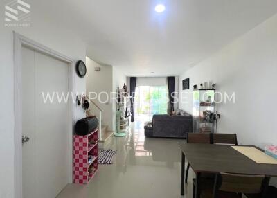 Modern living room with dining area and balcony