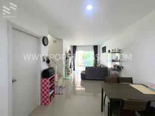 Modern living room with dining area and balcony