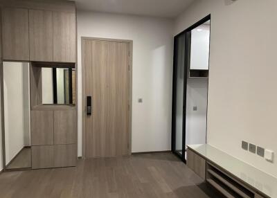 Modern room with wooden cabinets and mirror