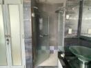 Modern bathroom with glass shower and frosted glass doors