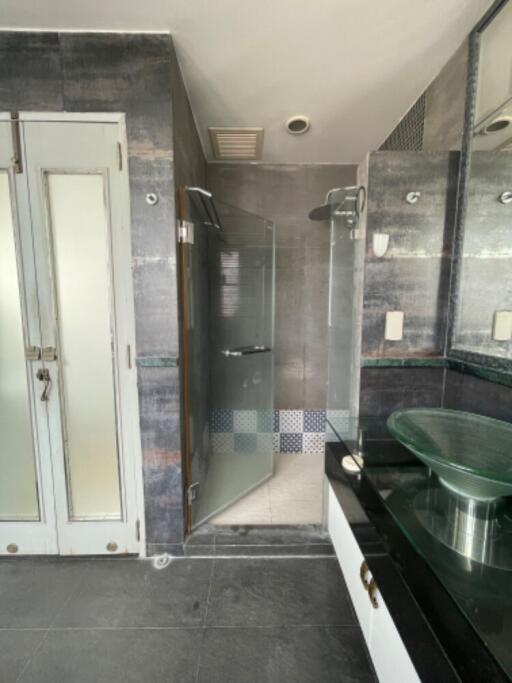 Modern bathroom with glass shower and frosted glass doors