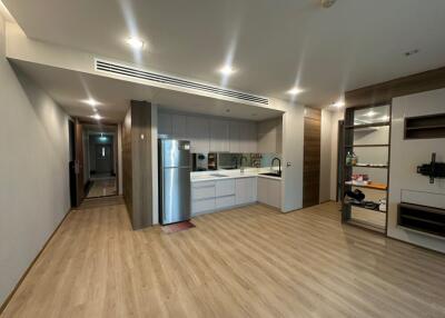 Modern kitchen interior with adjacent living area