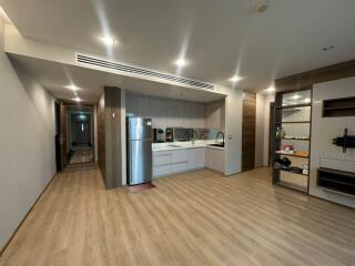 Modern kitchen interior with adjacent living area