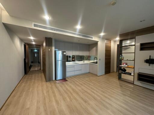 Modern kitchen interior with adjacent living area