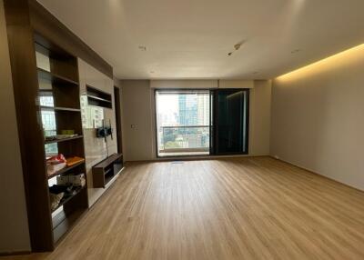 Modern living room with wooden floor and large window