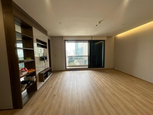 Modern living room with wooden floor and large window