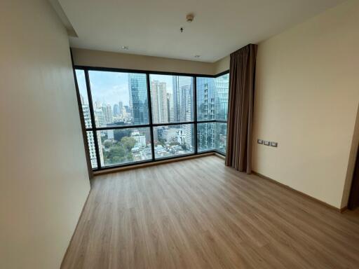 Living room with large window and city view