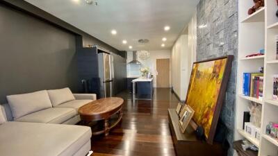 Modern living room with adjacent kitchen