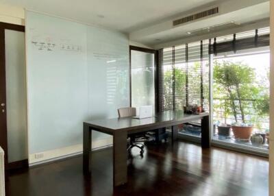 modern study room with large windows and desk