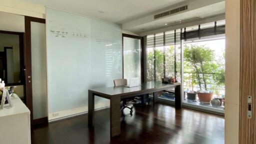 modern study room with large windows and desk