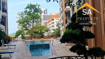 View of a pool area between two apartment buildings