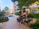 Outdoor common area with seating and pool