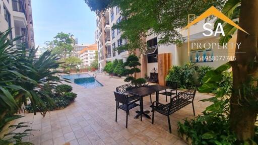 Outdoor common area with seating and pool