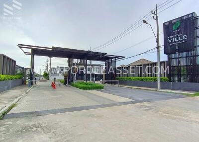 Main entrance and security gate of a residential complex