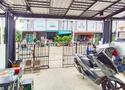 Outdoor view of residential building with garage and surrounding area