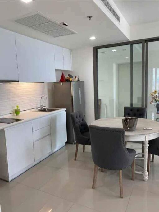 Modern kitchen with dining area and appliances