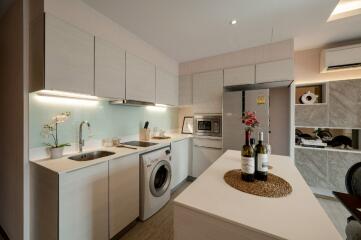 Modern kitchen with island counter and integrated appliances