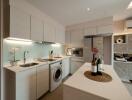 Modern kitchen with island counter and integrated appliances