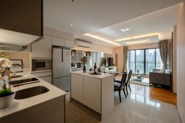 Modern open-plan kitchen and living area with city view