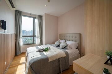 Modern bedroom with large window and city view