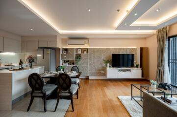 Modern living room with open kitchen and dining area