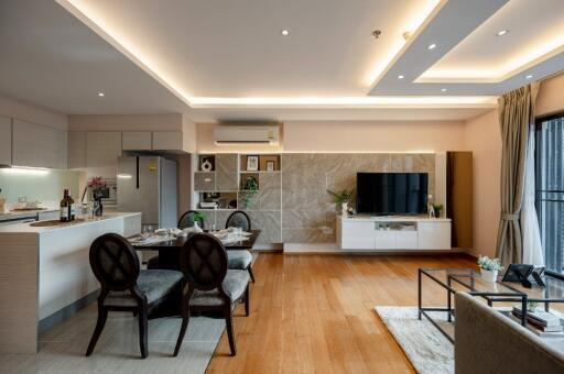 Modern living room with open kitchen and dining area