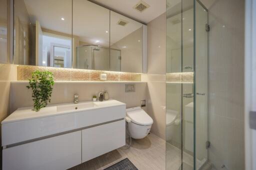 Modern bathroom with large mirror and glass shower