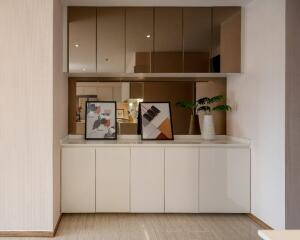 Modern dining room with white cabinets and mirrored accents