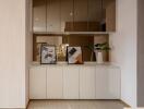 Modern dining room with white cabinets and mirrored accents