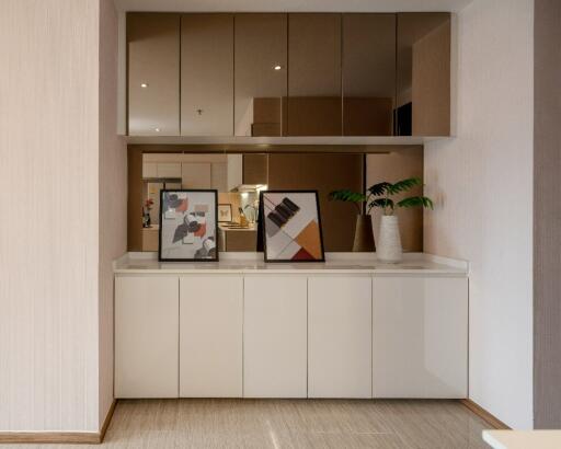 Modern dining room with white cabinets and mirrored accents