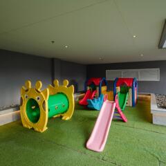 indoor playground with slides and tunnel