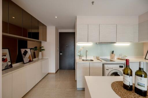 Modern kitchen with built-in appliances and sleek cabinets