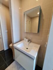 Modern bathroom with sink and wall-mounted mirror