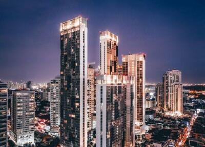 View of Park Origin Phrom Phong buildings at night