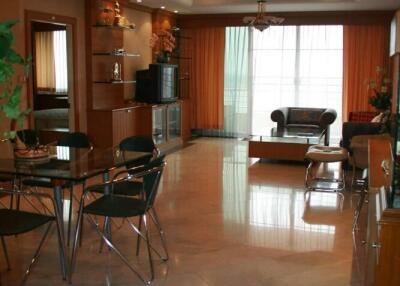 Spacious and well-lit living room with dining area