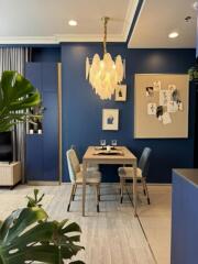 Cozy dining area with blue accent wall and modern decor