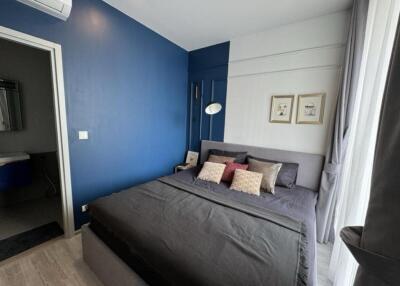 Modern bedroom with blue accent wall