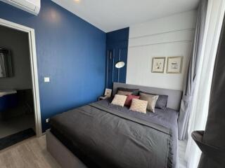 Modern bedroom with blue accent wall