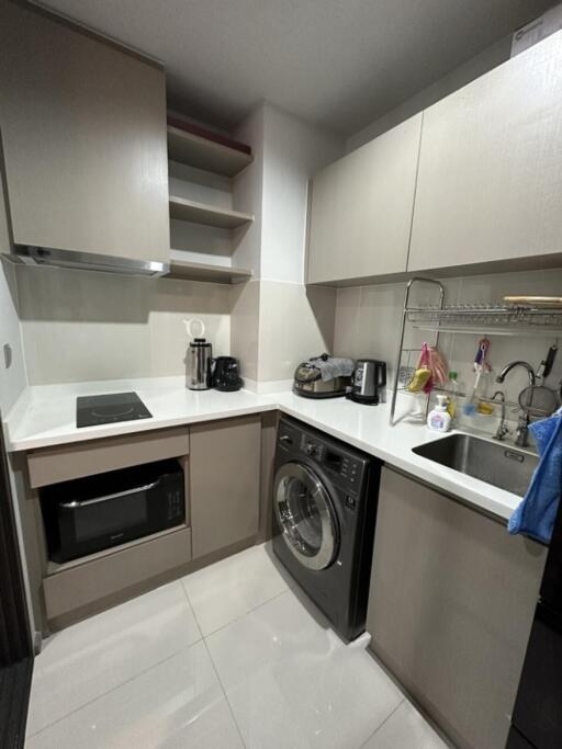 Modern kitchen with appliances and laundry area