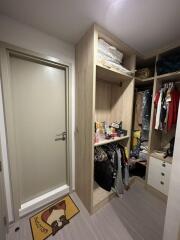 Closet with open shelving and various items