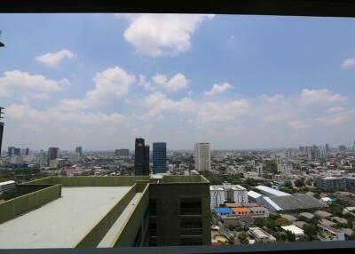 Balcony view from the building overlooking the city skyline