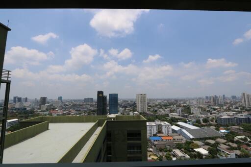 Balcony view from the building overlooking the city skyline