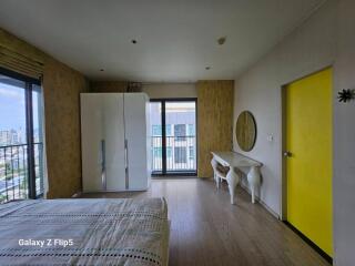 Modern bedroom with large windows