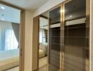 Spacious bedroom with large mirrored wardrobe and ample natural light