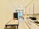 Modern kitchen with dining area and large window