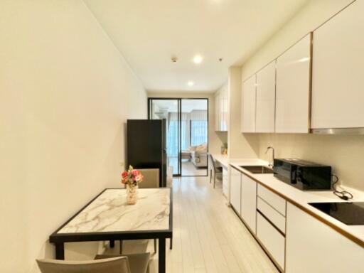 Modern kitchen with dining area and large window