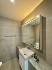 Modern bathroom with a large mirror and a sink