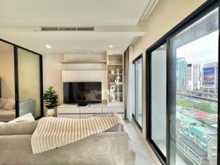 Modern living room with large windows and city view